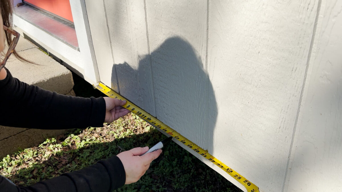Installing skirting on a shed -- mark for any areas that doesn't need skirting, like behind front door steps.