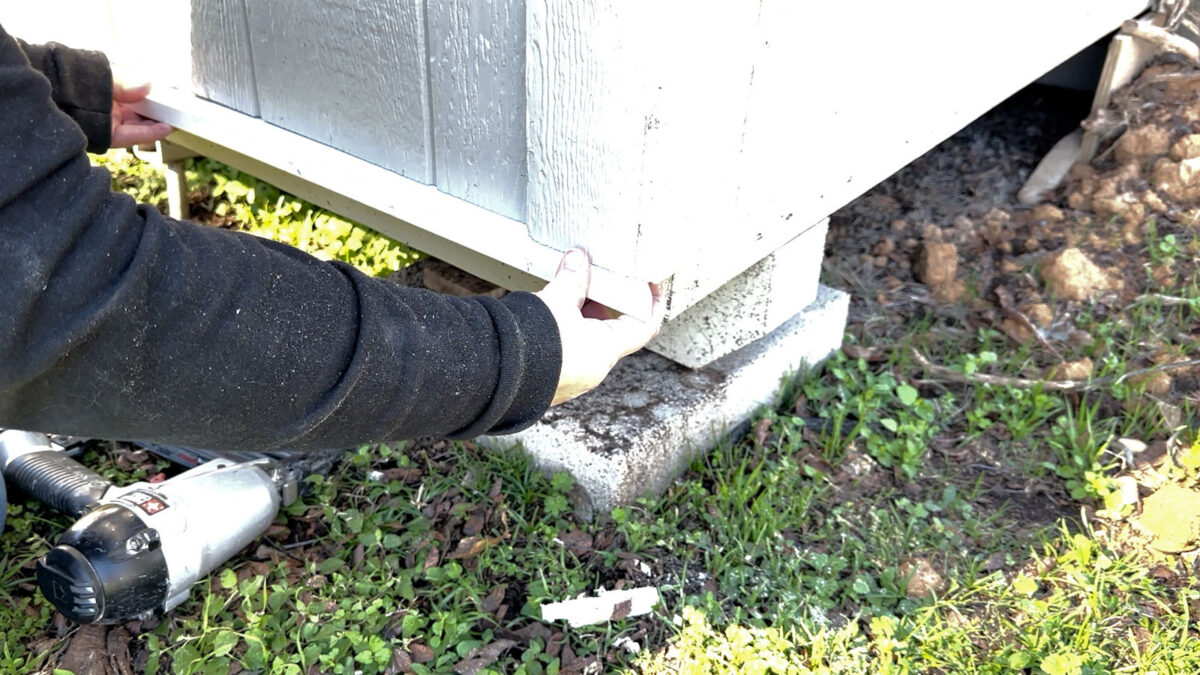 Add skirting to outdoor shed or workshop -- Add ledger board as transition between siding and skirting.