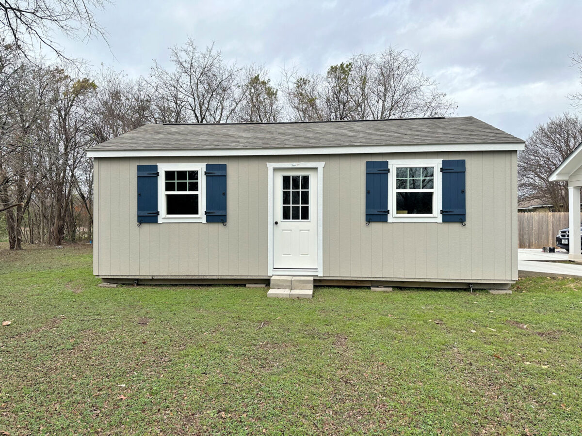 My back yard shed workshop with new DIY shutters installed