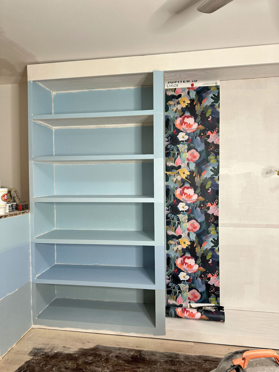 Walk-in closet paint color ideas - Light blue paint samples for walk-in closet cabinets with floral wallpaper